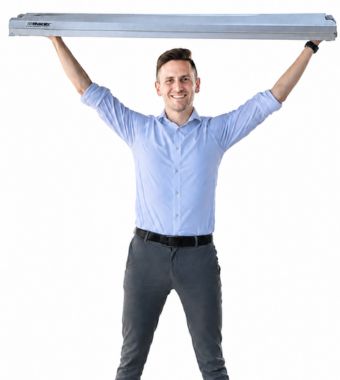 Man holding a ProFlex Feather-Lite stage panel overhead